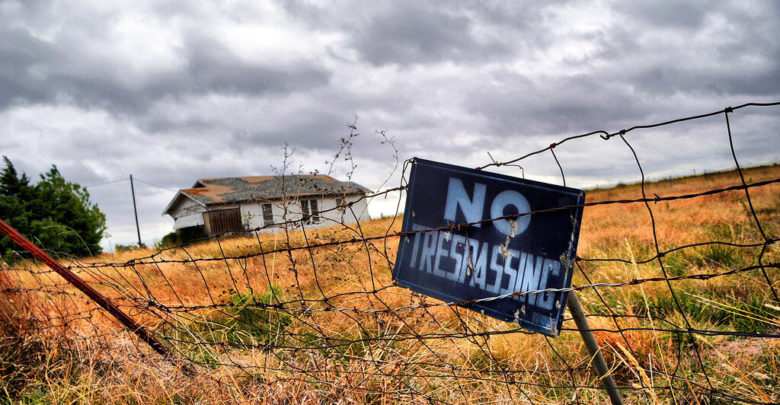 abandoned house with no trespassing sign