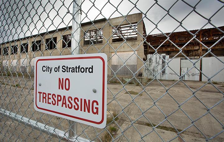 abandoned factory with no trespassing sign