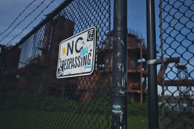 abandoned building with no trespassing sign