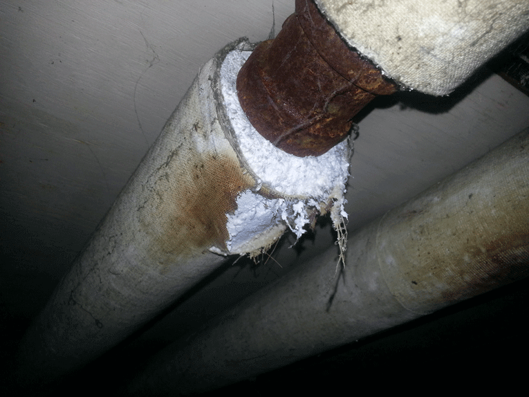 Steam pipe with asbestos insulation wrapped around it